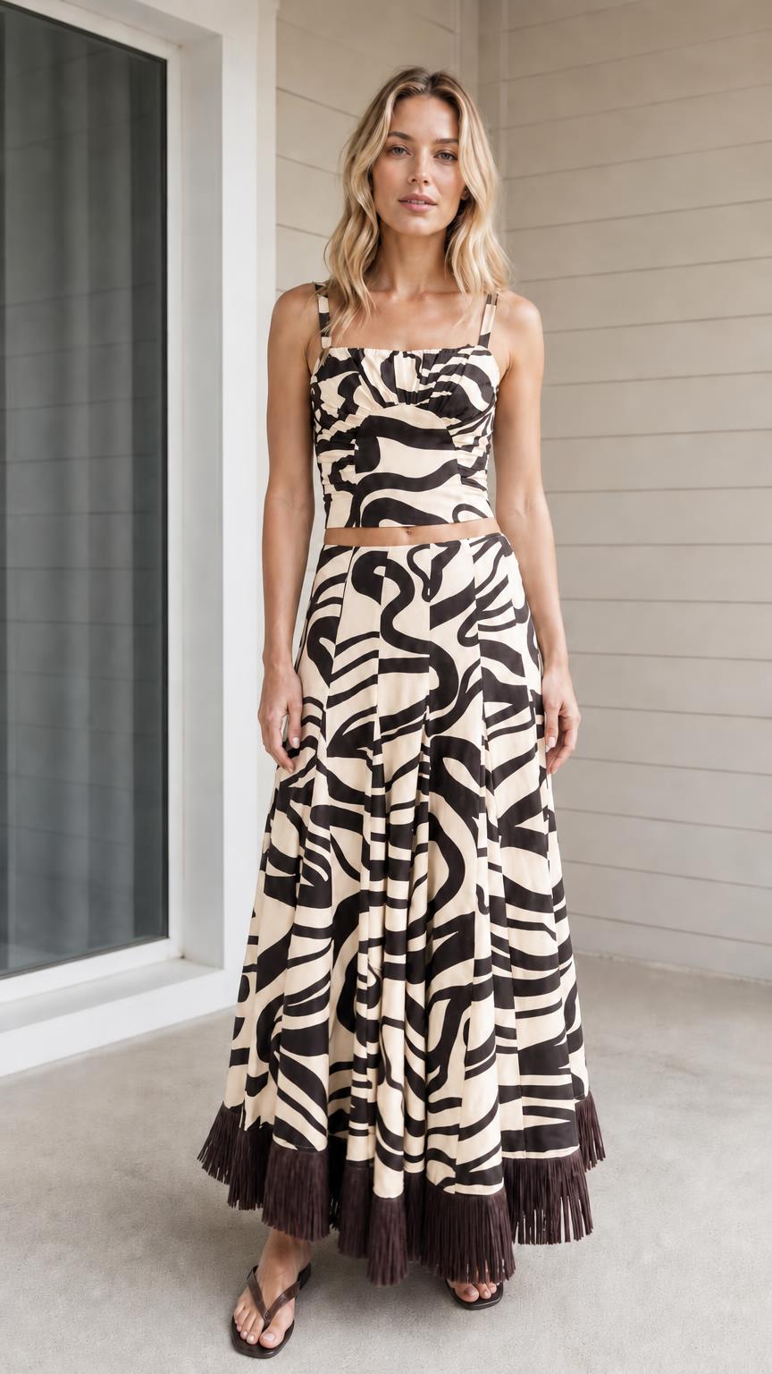 Model wearing beige zebra print crop top and maxi skirt set