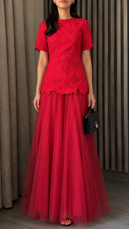 Front view of red floral textured short sleeve maxi evening dress with flowing tulle skirt