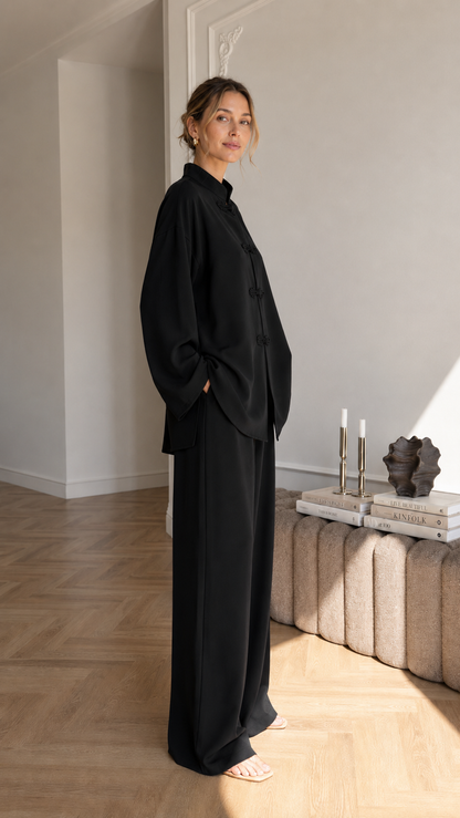 Women's black mandarin collar two-piece lounge set with long sleeve top and wide leg pants side view