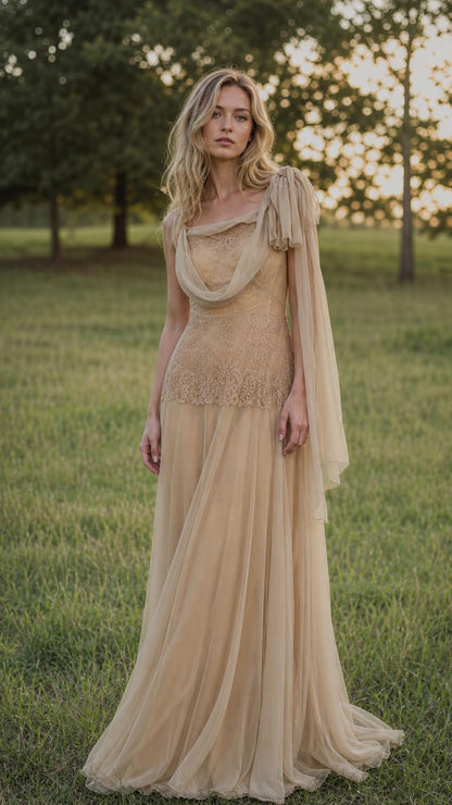 Front view of model wearing champagne draped tulle maxi dress
