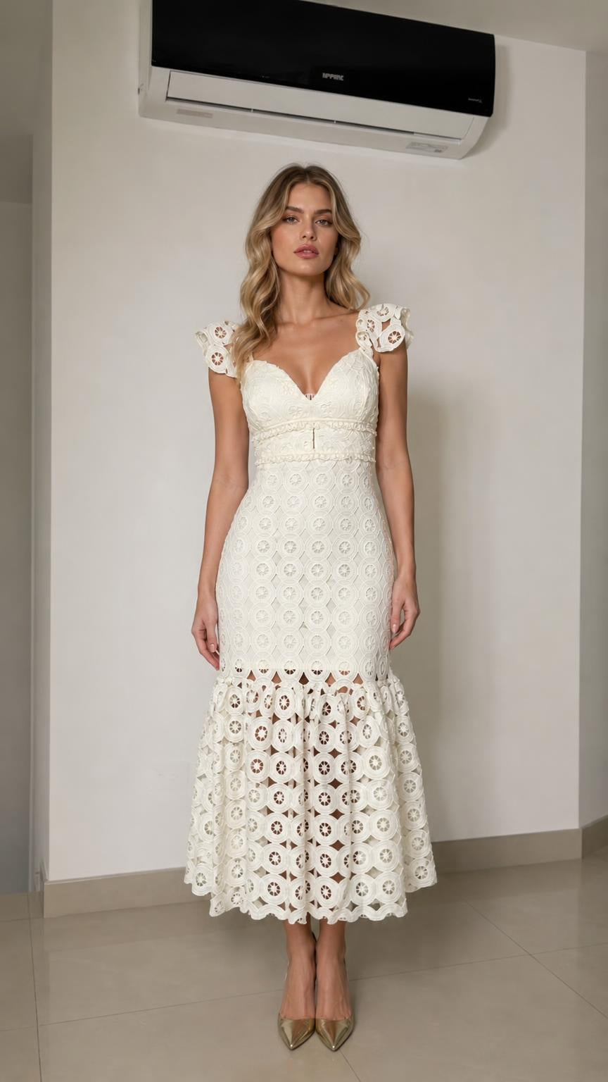 Front view of woman wearing white lace mermaid midi dress
