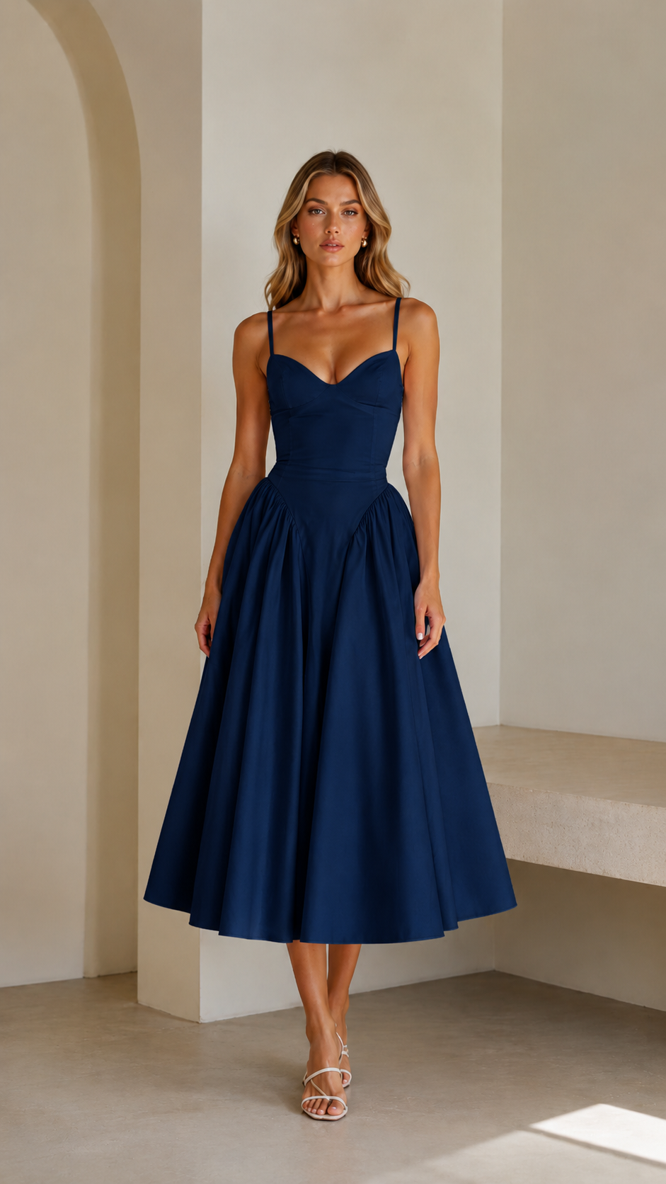 Front view of navy sweetheart neck spaghetti strap midi dress with full skirt