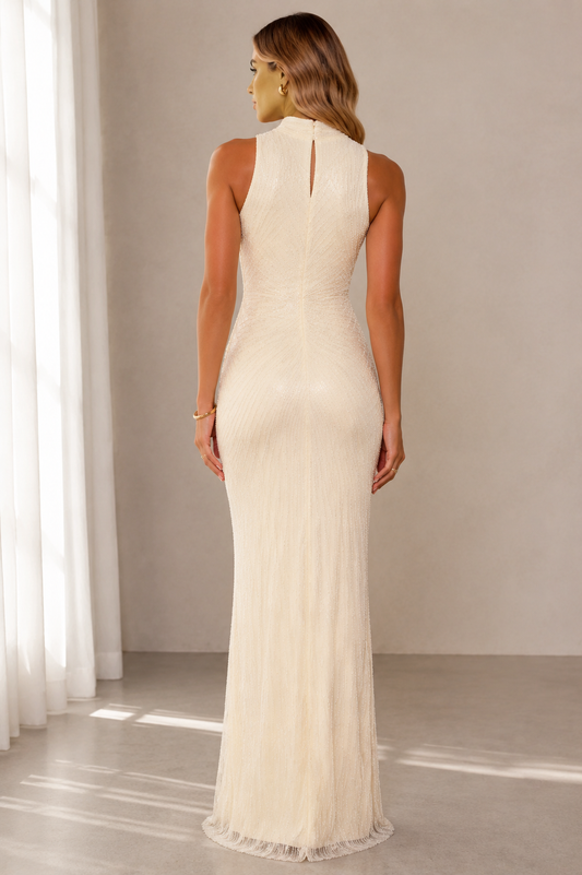 Back view of ivory sleeveless textured maxi gown with keyhole detail