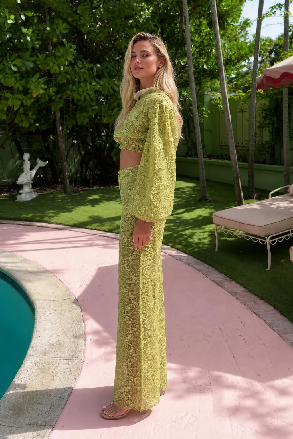 Side view of model wearing olive two-piece set outdoors