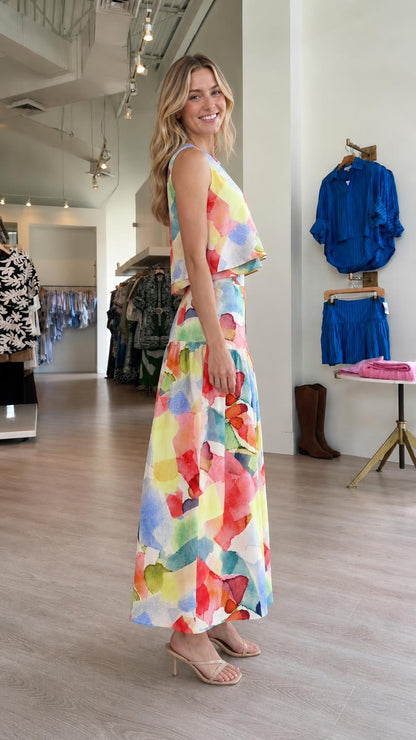 Side view of model wearing colorful abstract print set