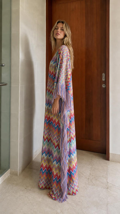 Side view of model in multi-colored chevron fringe maxi kaftan dress