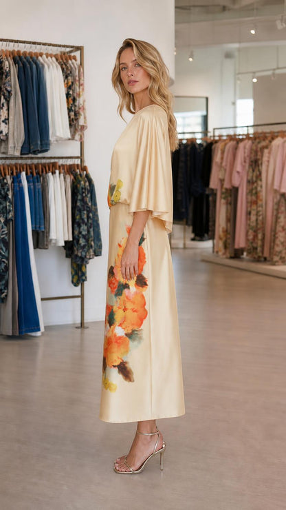 Side profile view of champagne midi dress
