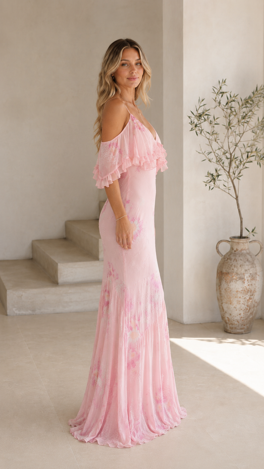 Blush pink floral maxi dress side view with flutter ruffle overlay