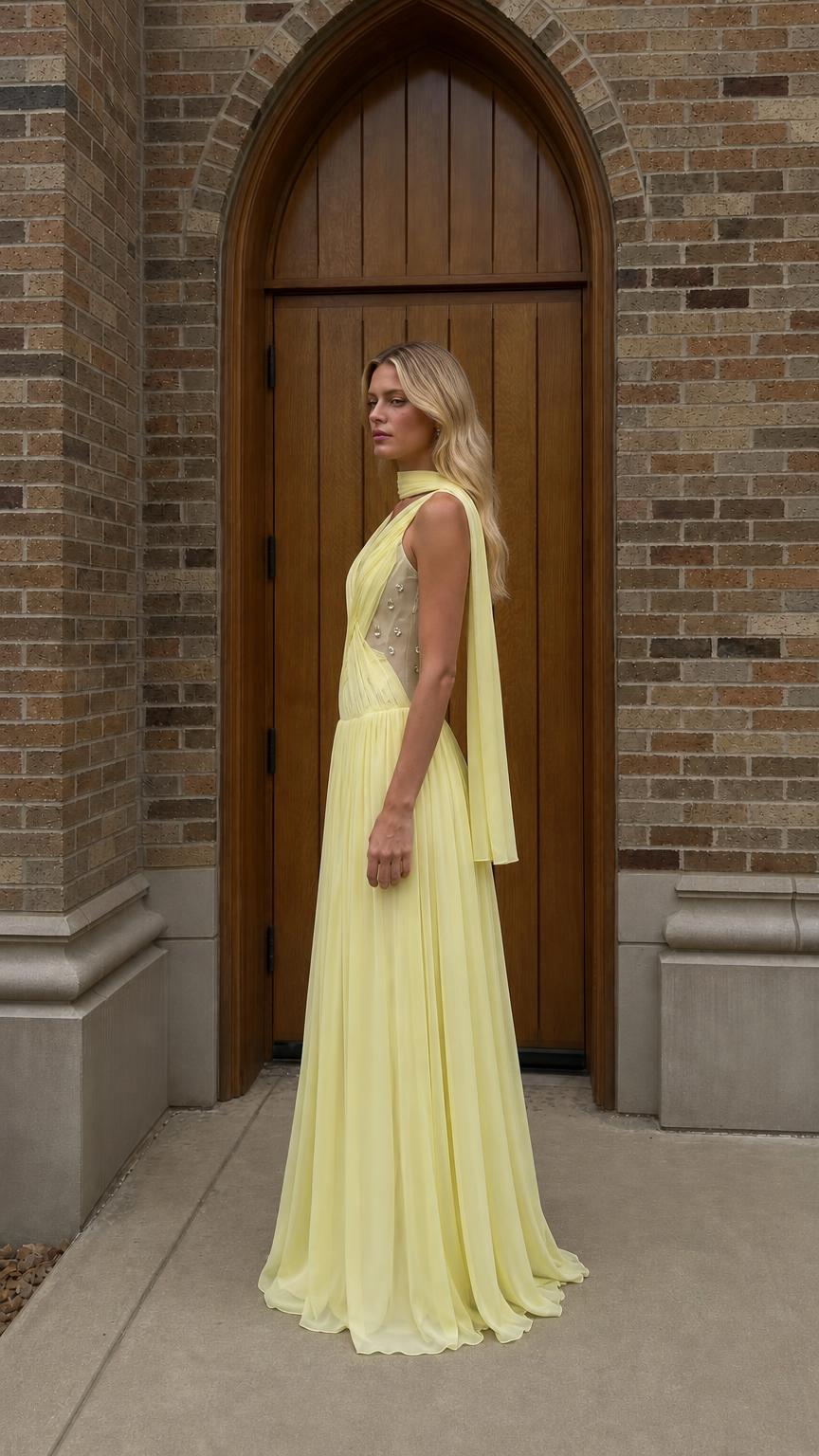 Side profile view of yellow chiffon evening gown