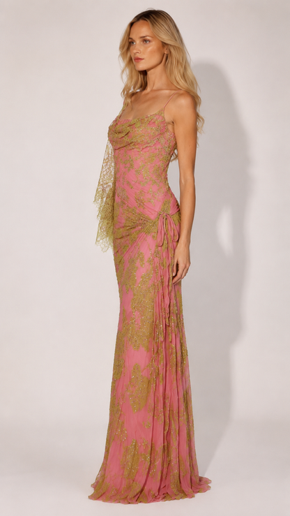 Side view of pink floor-length shimmer gown with slim straps and gathered hip detail
