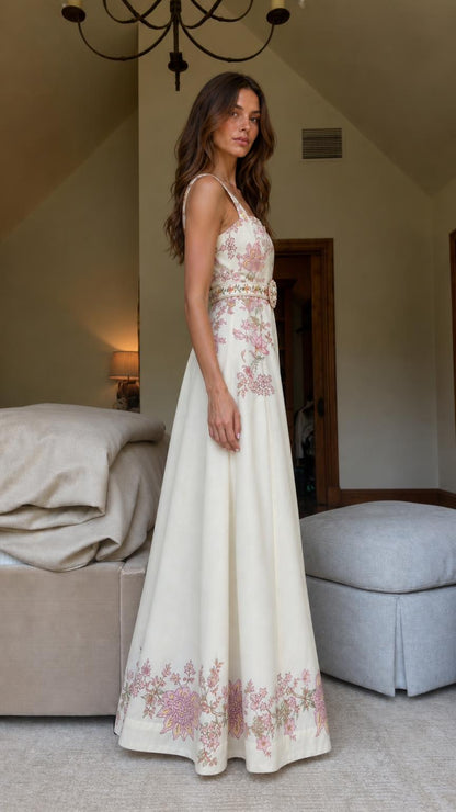 Side profile view of cream floral embroidered maxi dress