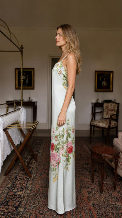 Side profile of model in sage floral satin maxi dress