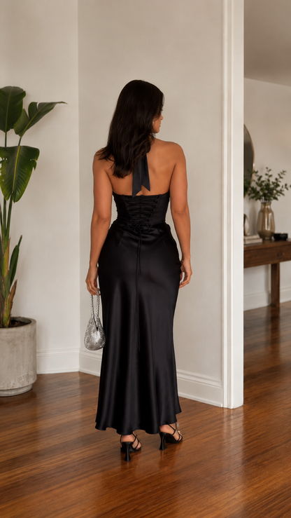 Back view of black backless halter satin-look maxi dress