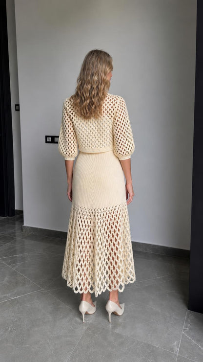Back view of cream knit cardigan and skirt set