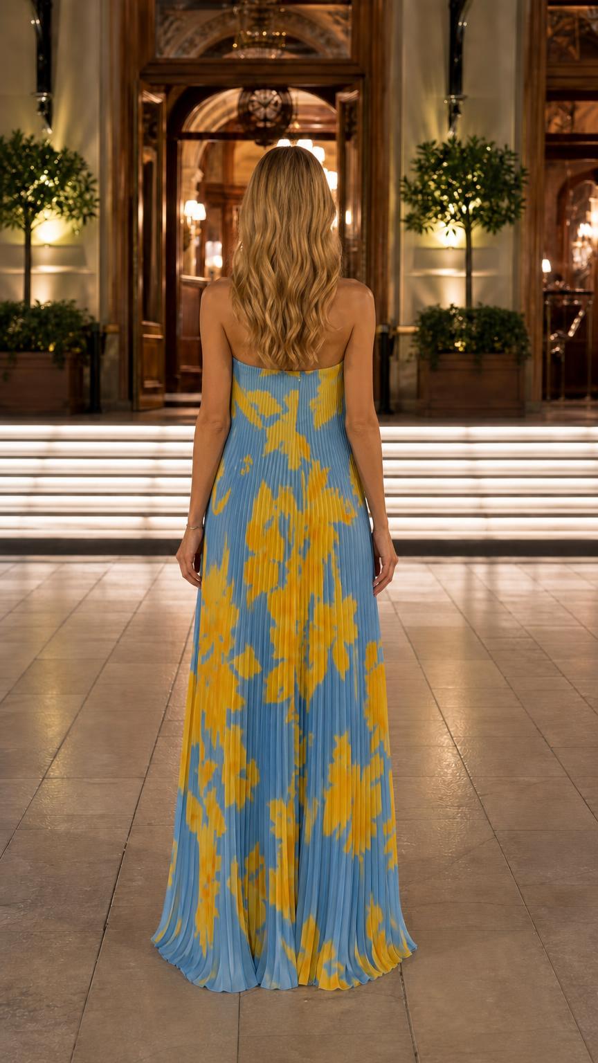 Back view of blue floral pleated maxi dress