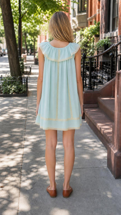 Back view of light blue ruffled mini dress