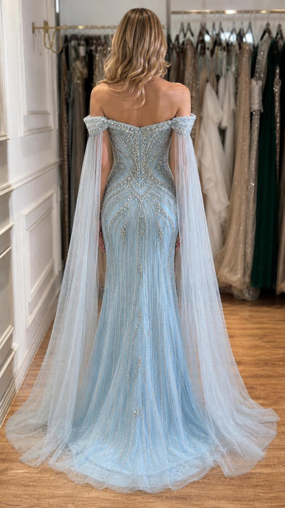 Back view of light blue evening gown with sheer cape