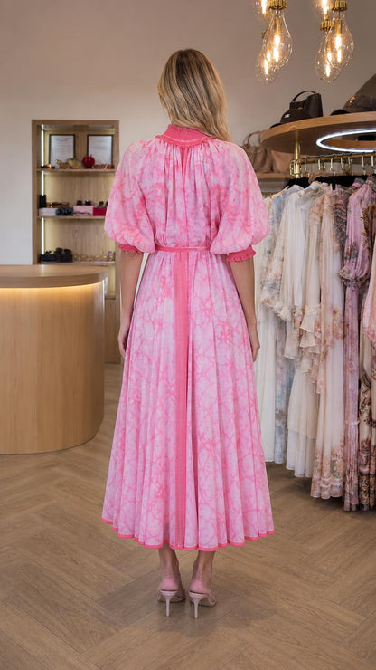 Back view of model wearing pink tie dye midi dress