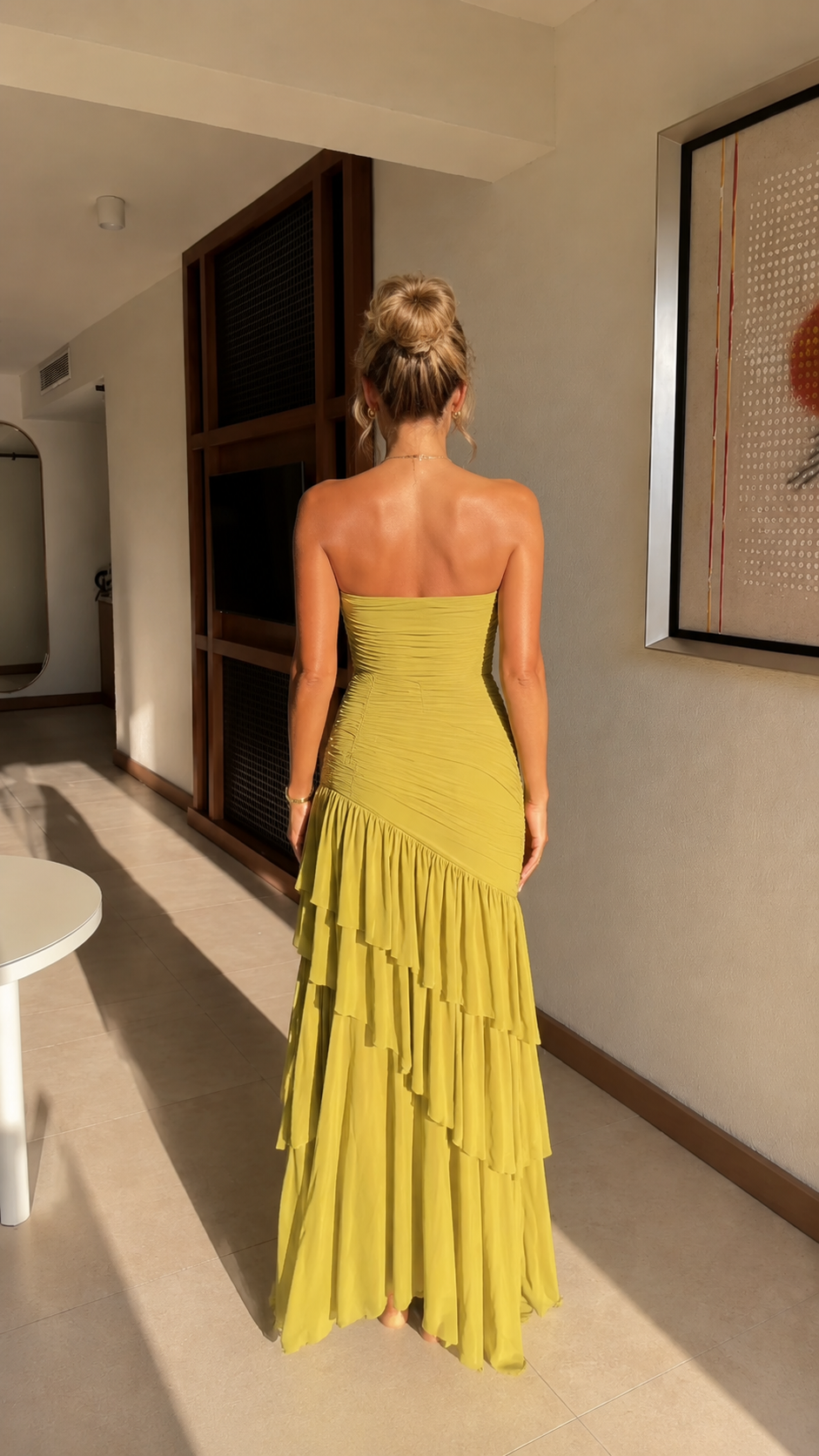 Back view of chartreuse strapless ruched tiered maxi dress