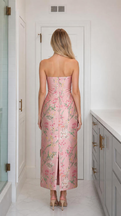 Back view of model wearing pink floral strapless midi dress
