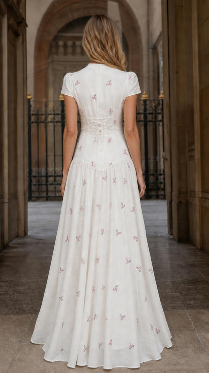 Back view showing lace-up details on White maxi dress