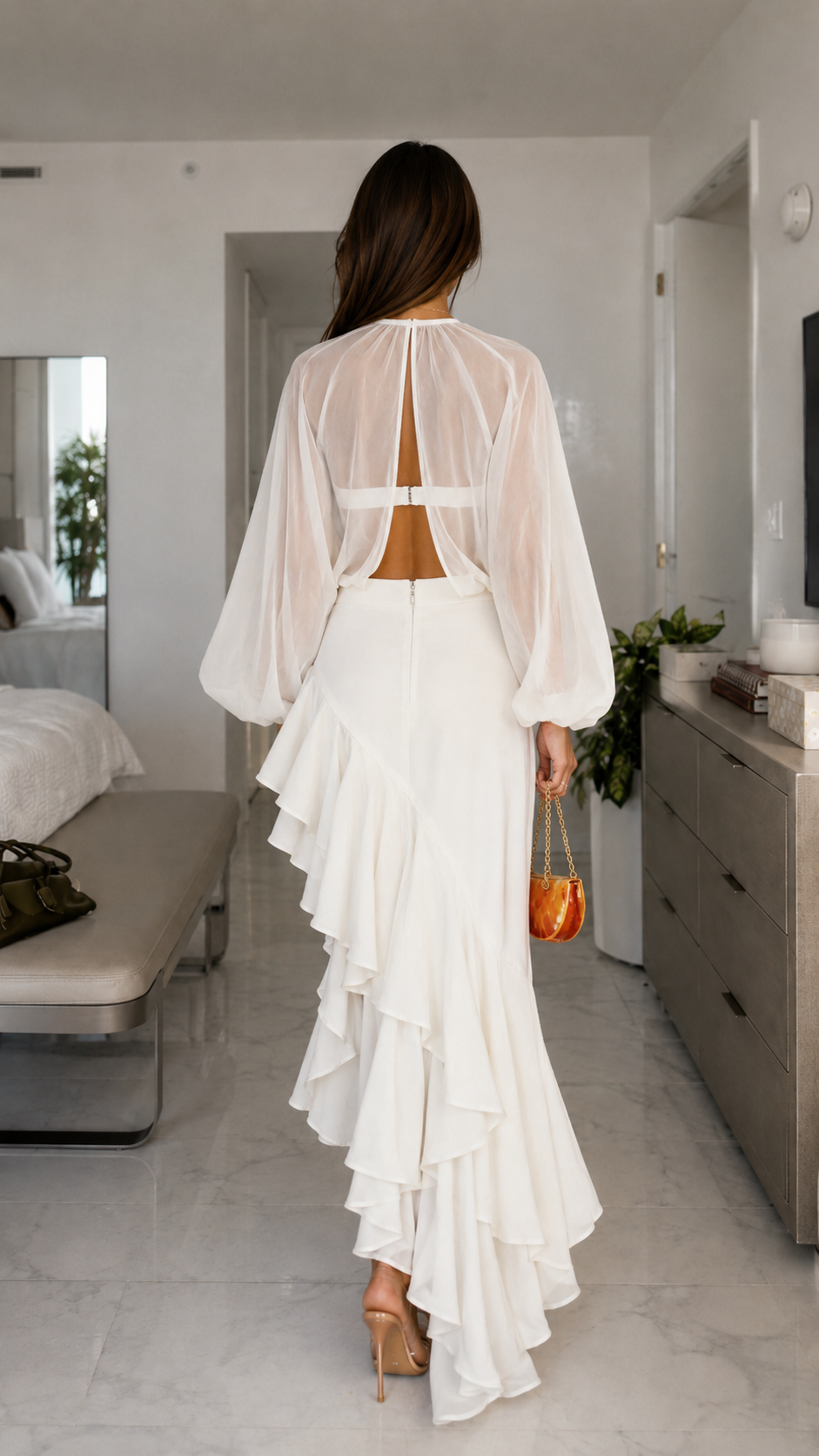 Back view of white cutout maxi dress with open back and layered ruffle hem