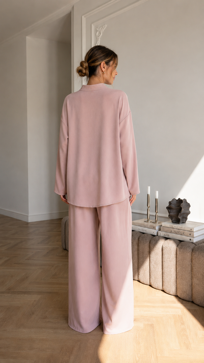 Women's blush pink two-piece lounge set back view with long sleeve top and wide leg pants