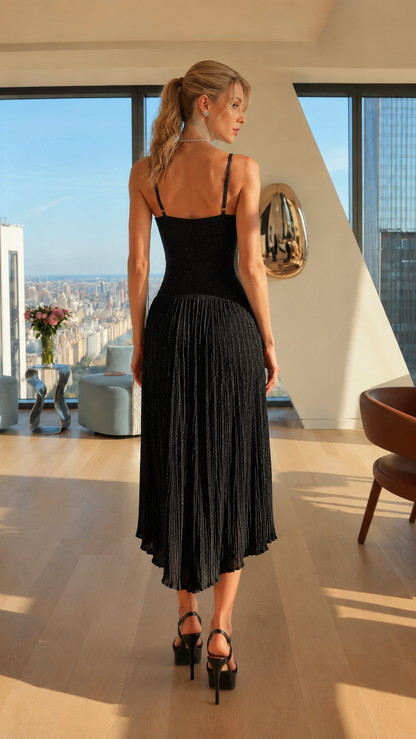 Back view of black shimmer pleated midi dress with pleated skirt