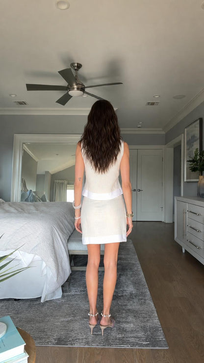 Back view of model in beige two-piece outfit