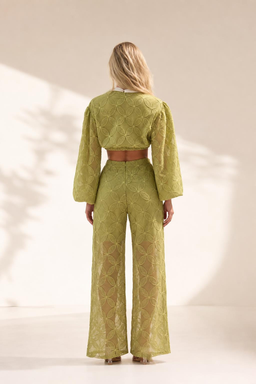 Back view of model wearing olive textured matching set