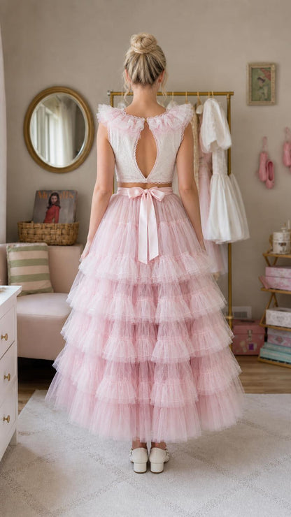 Back view showing cutout detail and bow on pink tulle dress
