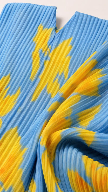 Close-up texture of blue and yellow pleated fabric