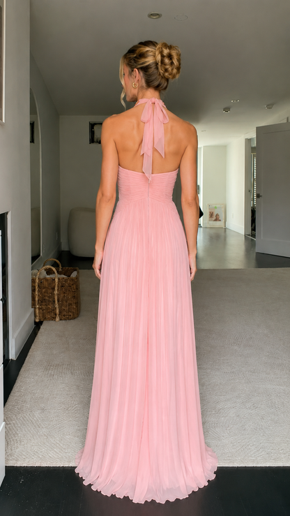 Back view of blush pink halter pleated maxi dress with tie neck