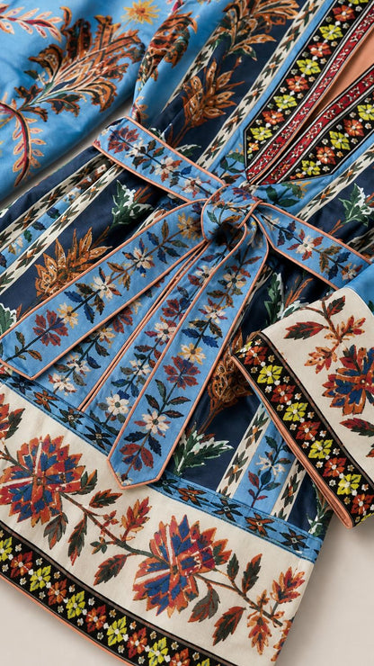 Close-up of blue boho floral print fabric and tie belt detail