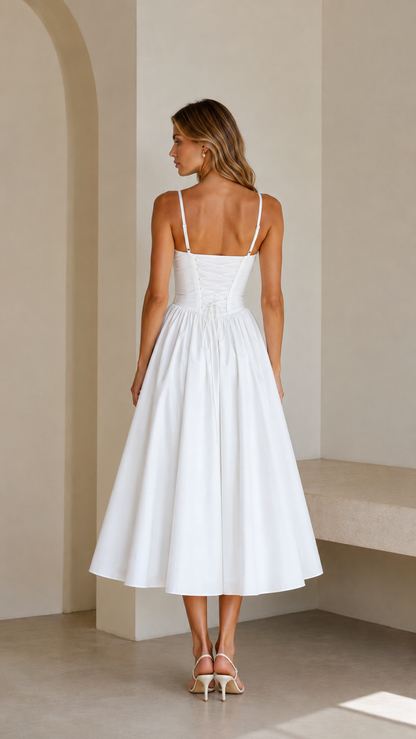 Back view of white spaghetti strap midi dress with fitted bodice and full skirt