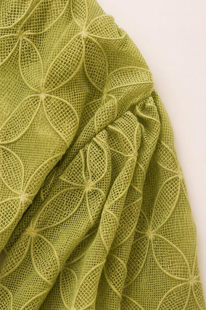 Close-up detail of the geometric textured olive fabric