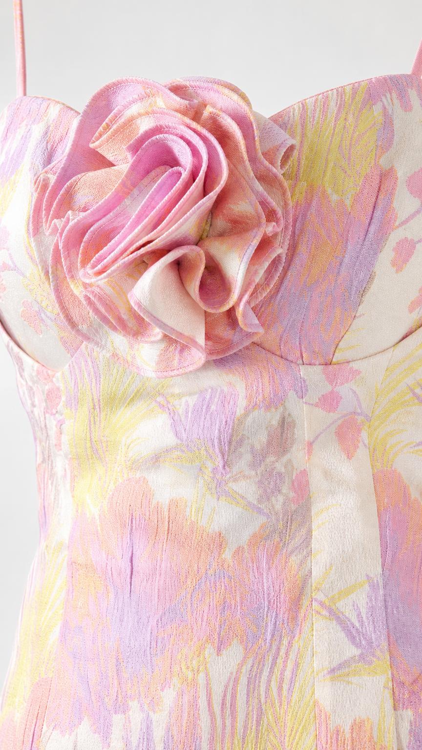 Close-up detail of the 3D fabric rosette on the bodice