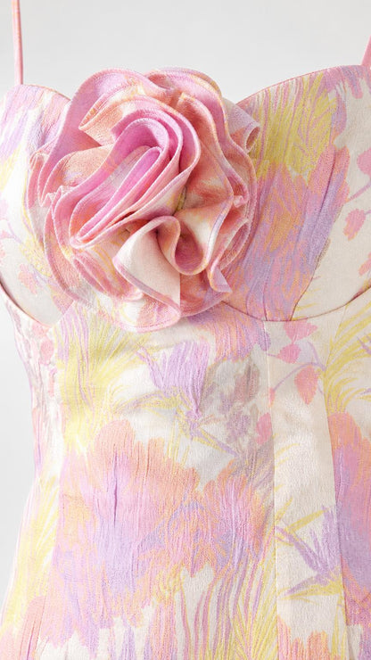 Close-up detail of the 3D fabric rosette on the bodice