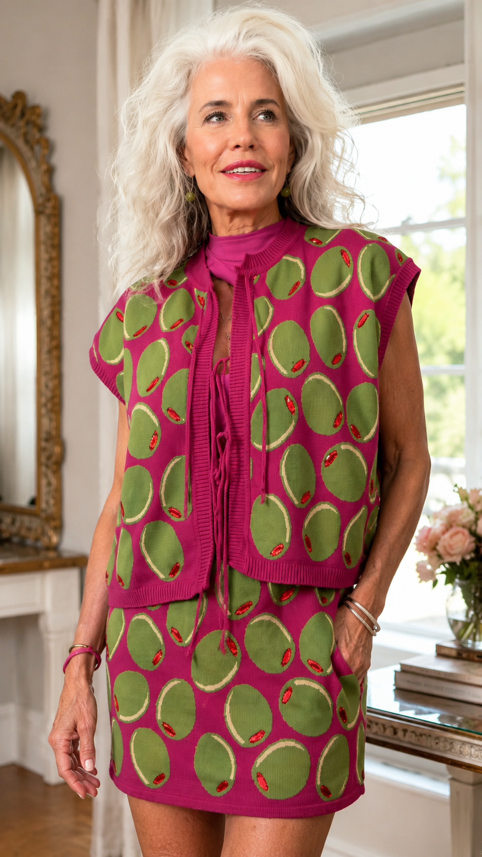 Close-up of fuchsia oversized dot print sleeveless top with tie-neck detail