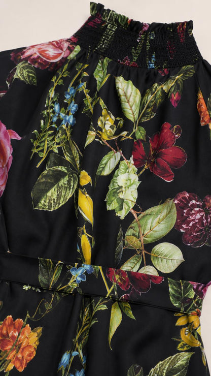 Close-up of smocked halter neckline and floral fabric detail