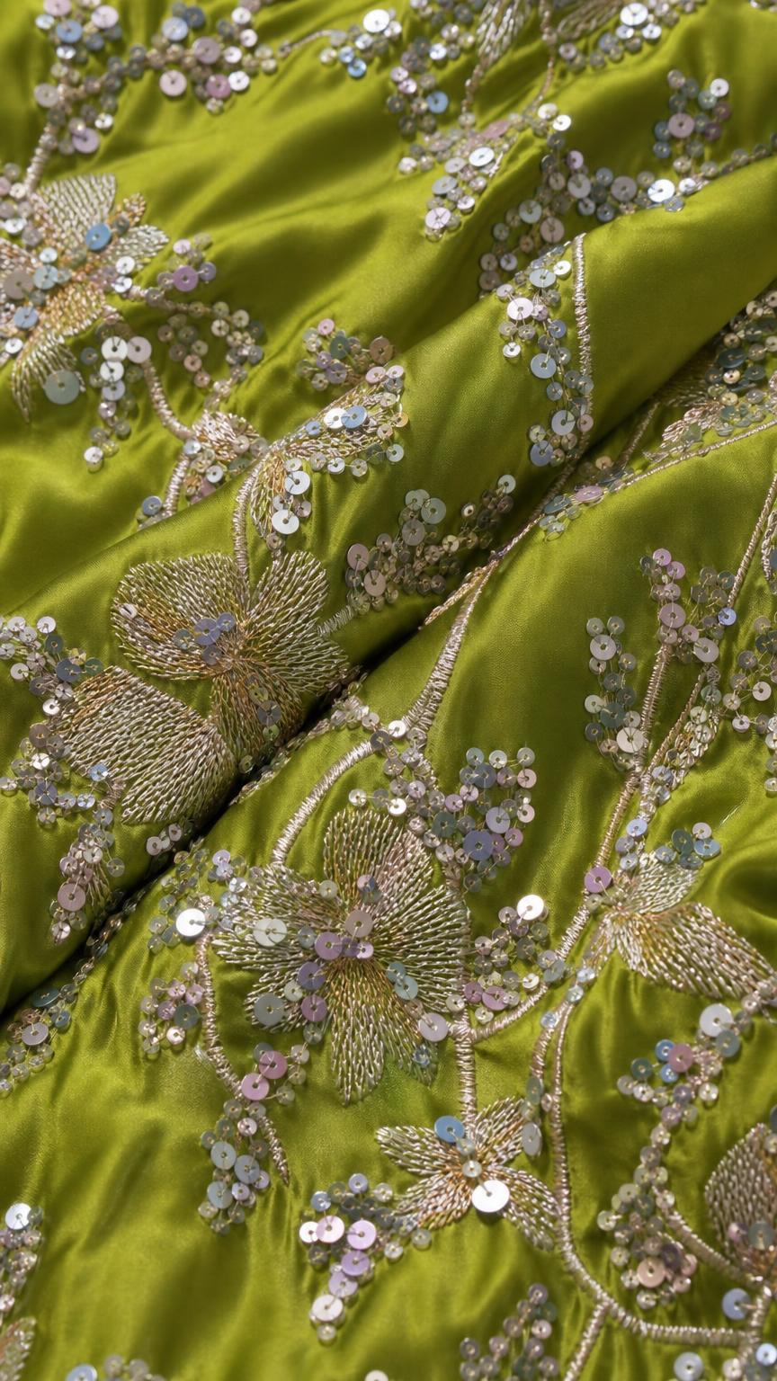 Close-up of sequin and bead embroidery on Lime fabric