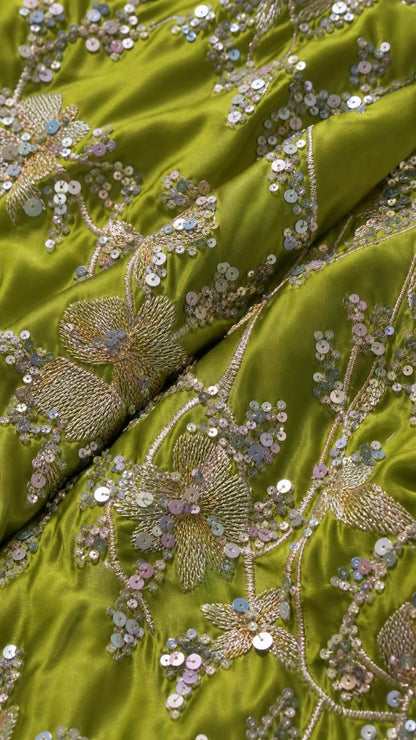 Close-up of sequin and bead embroidery on Lime fabric