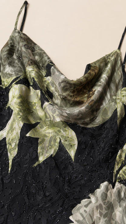 Close-up detail of cowl neckline and floral pattern