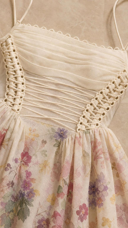 Close-up detail of ivory floral dress bodice and lace-up side