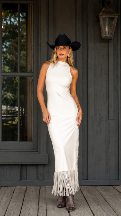 Front view of ivory sleeveless mock neck fringe hem maxi dress