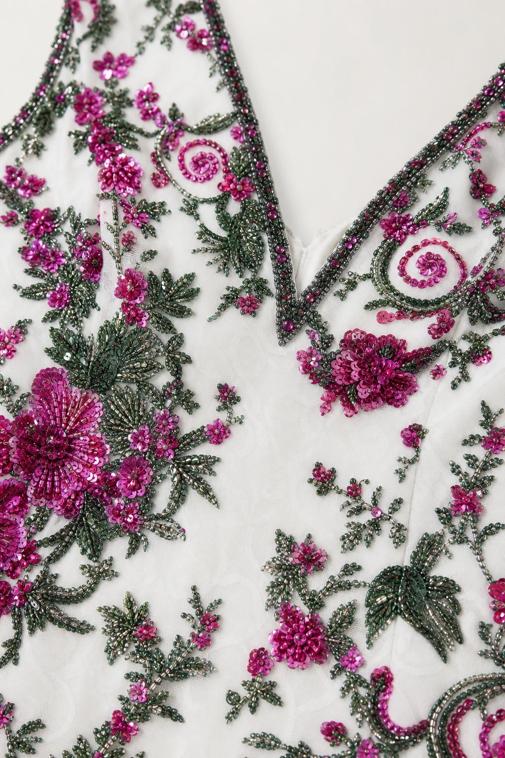 Close-up detail of floral beadwork and embroidery