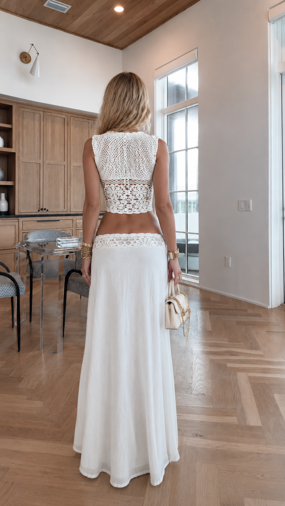Back view of white crochet lace crop top and flowing maxi skirt set