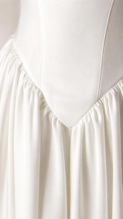 Close-up detail of bodice drop-waist gathering