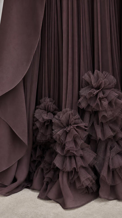 Close-up of pleated skirt and dimensional ruffled hem details