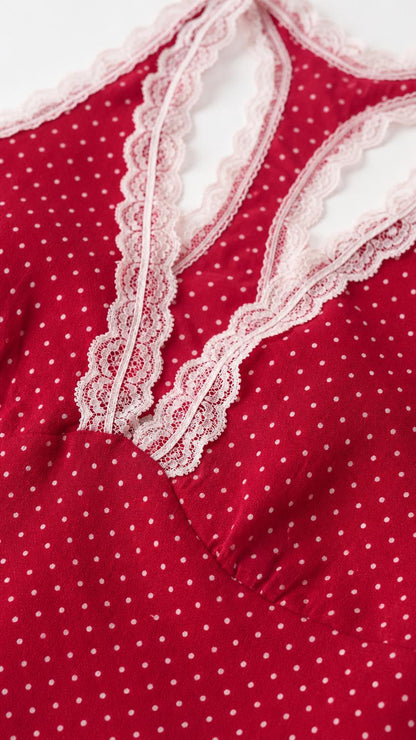 Close-up of lace trim detail on the red polka dot dress